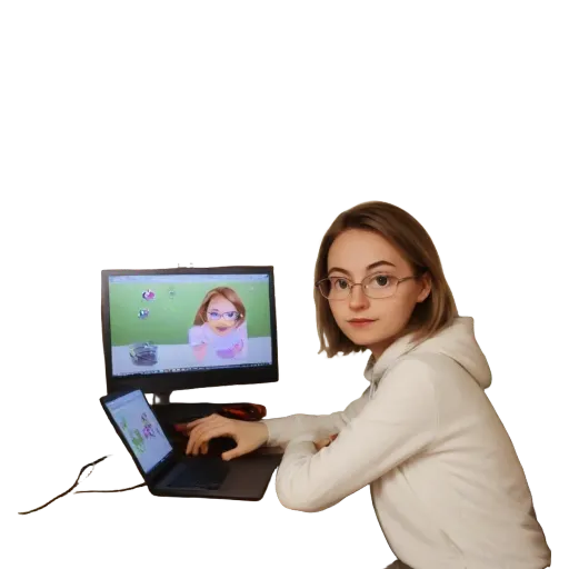 A woman is sitting at a computer with a large monitor.