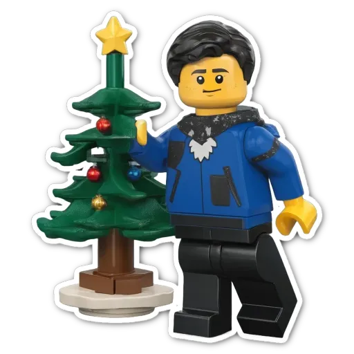 A blue lego figure in front of a tree.