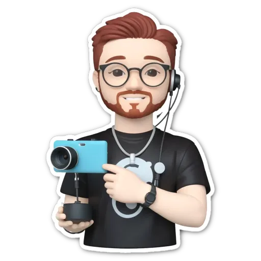 A man wearing black and holding a camera.