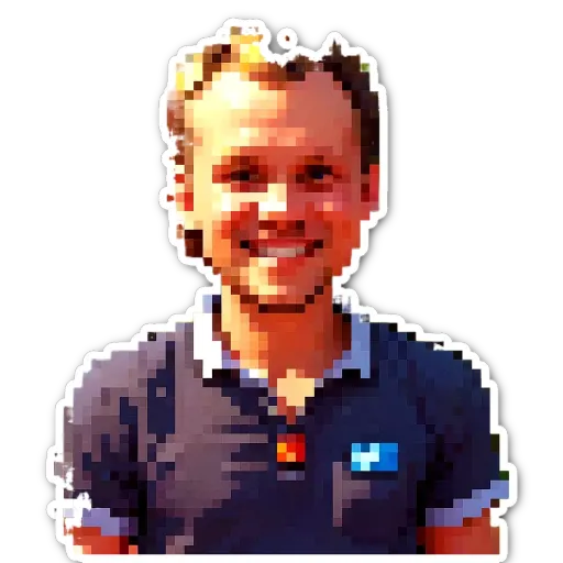 A man is smiling and has the word HEXAGON in his blue shirt.