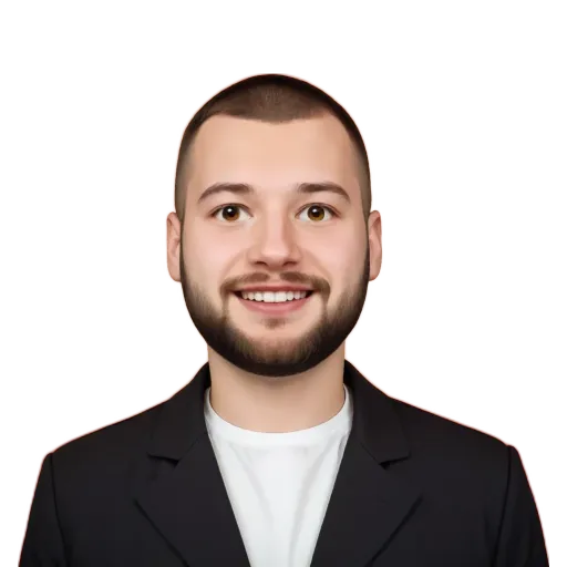 A man wearing a suit and smiling.