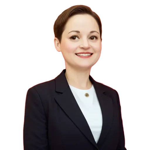 A woman wearing a suit is smiling.