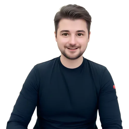 A man wearing a blue shirt is sitting in front of a black background.