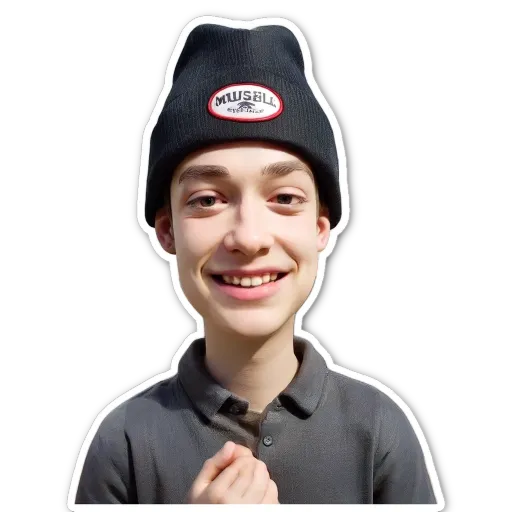 A boy is wearing a Mussel hat and smiling.