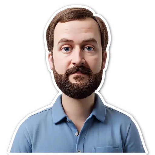 A white face with a blue shirt and a beard.
