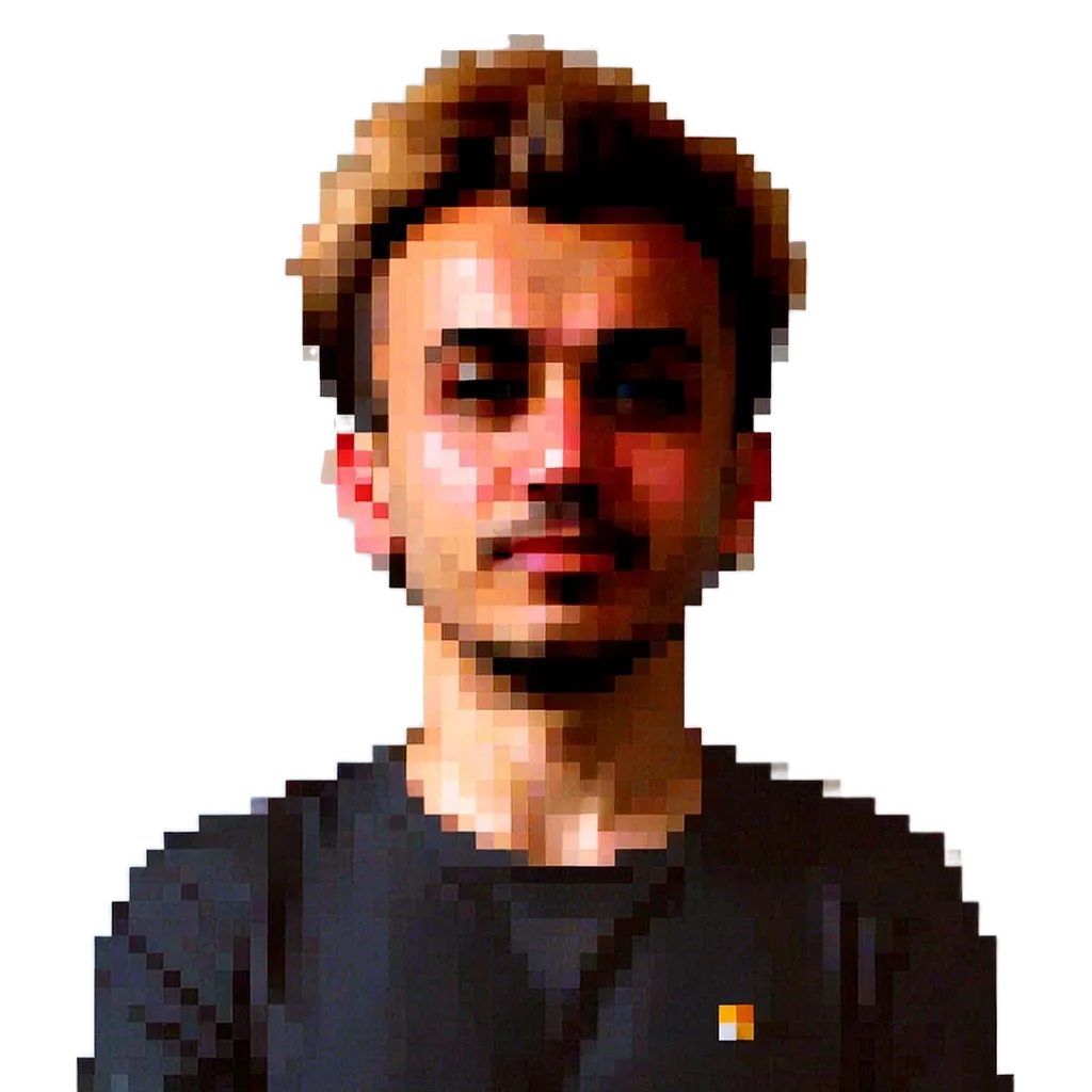 A man with a black shirt that has a small orange square on it.