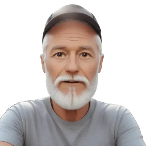 A man with a beard and a gray shirt is sitting in front of a truck.