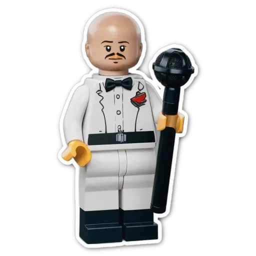 A lego person holding a microphone with a red heart.