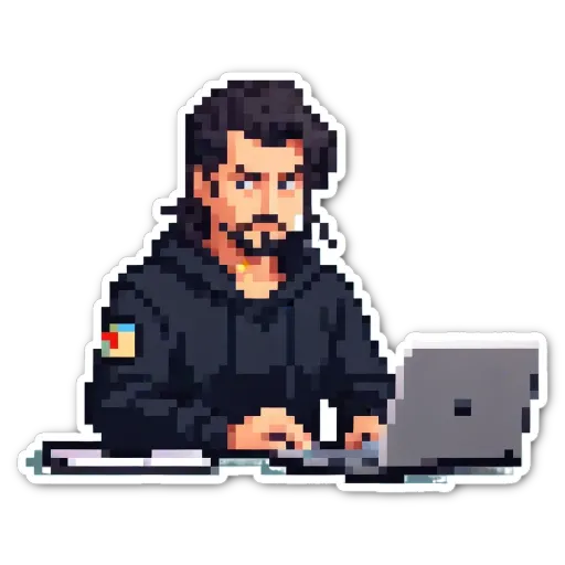 A man using a laptop who is wearing a black jacket with a patch on it.
