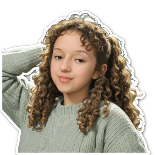 A girl with curly hair wearing a sweater.