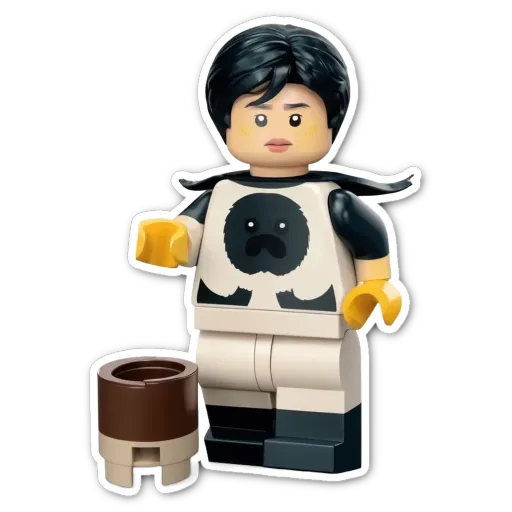 A black and white lego person who looks sad.
