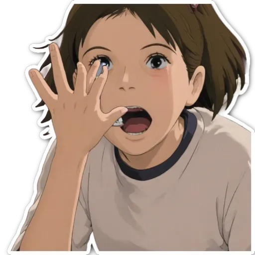 A girl with her hand over her face crying.