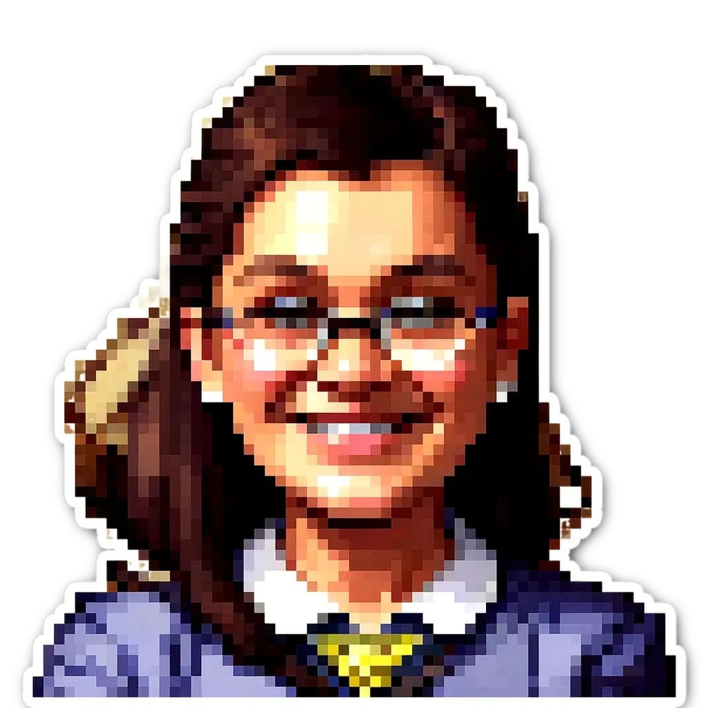 A girl wearing glasses is smiling at the camera.