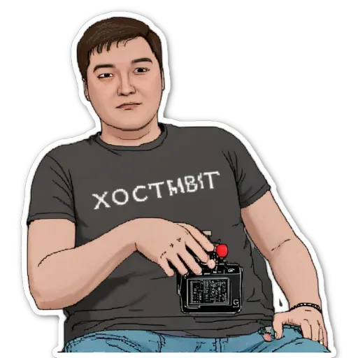 A man with a camera around his neck is wearing a grey shirt with the word XOCTABIT on it.