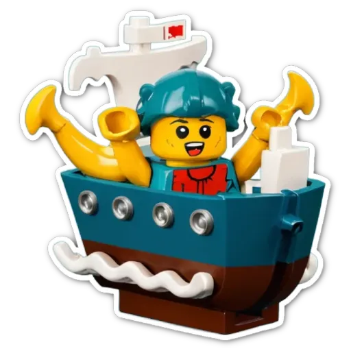 A lego boy in a toy sailboat.