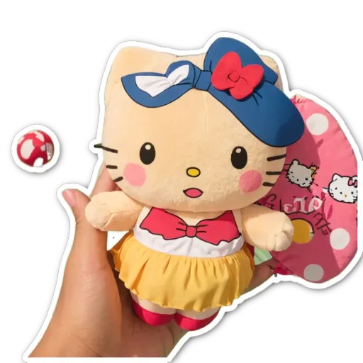 A hand holding a Hello Kitty doll with a polka dot skirt.