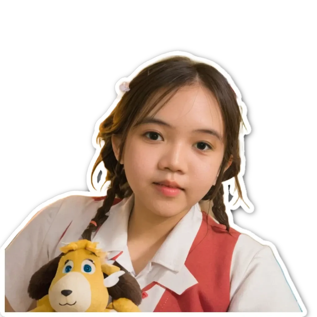 A young girl holding a stuffed animal.