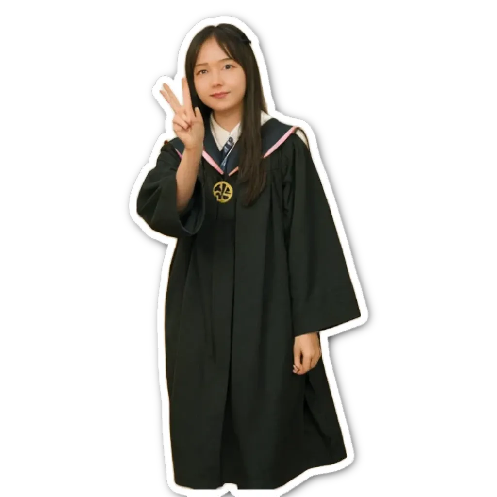 A girl is wearing a graduation robe and giving a peace sign.