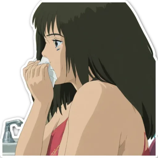 A woman is blowing her nose.