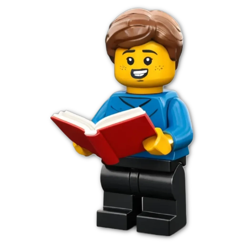 A plastic lego boy reading a book with a smile on his face.