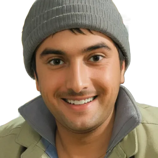 A man wearing a grey hat and light jacket is smiling.